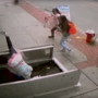 Footage shows a distracted woman on her cellphone fall into an open sidewalk cellar