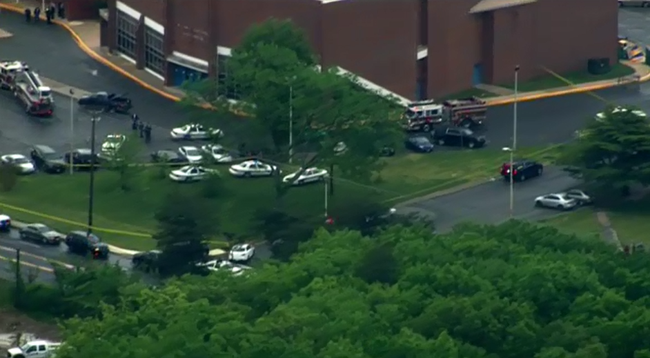 Police looking for suspect who killed 1, wounded 1 in domestic shooting at high school WJLA